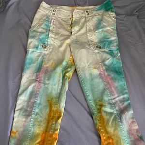 Homemade tie dyed pants, holes along both sides, zippers at the end.